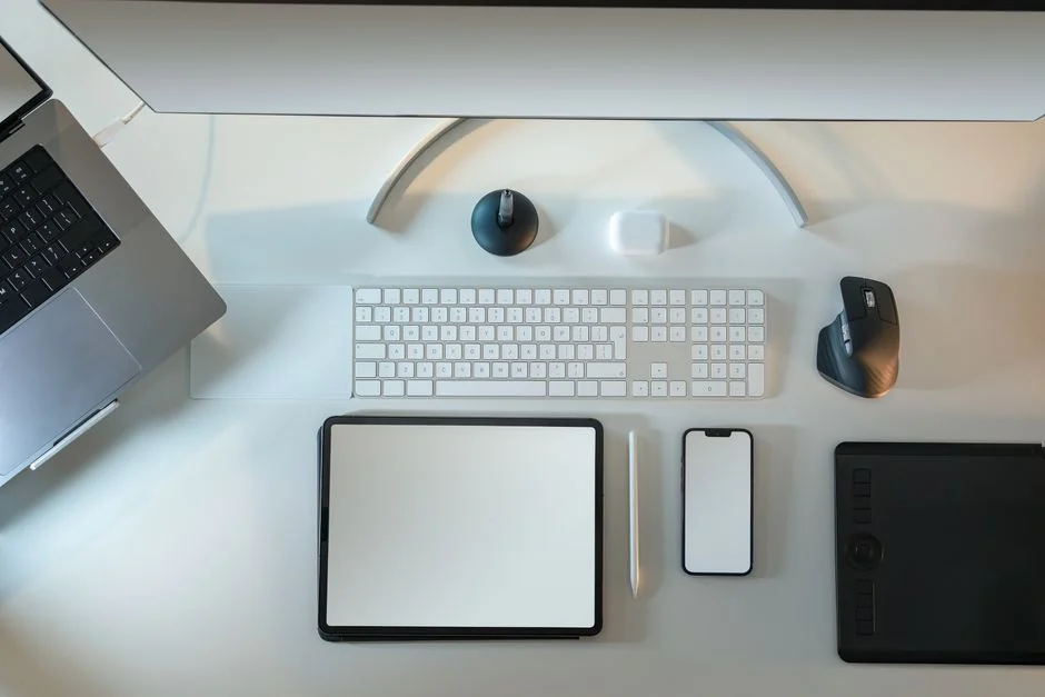 Close-up view of hands using a shopping website displayed on a laptop screen indoors.
